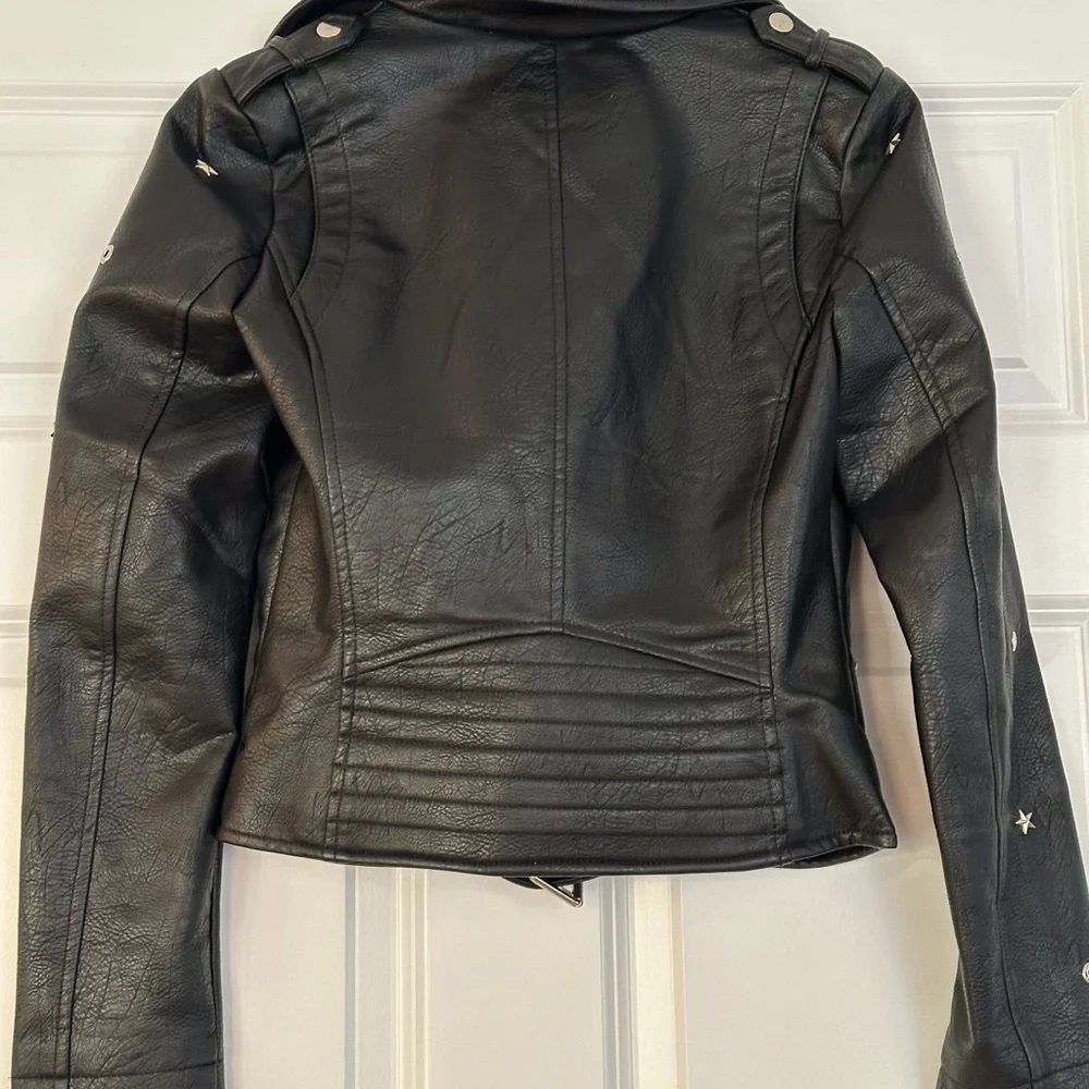 Edgy Moto jacket with studs, perfect layering over jeans or a skirt